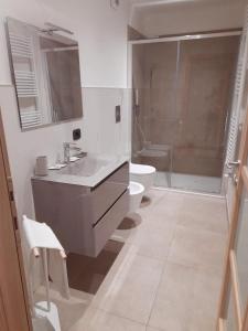 a bathroom with a sink and a shower and a toilet at Torino Vacancy 5 Your House Downtown in Turin +11 photos