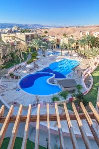an overhead view of a pool at a resort at Marina Plaza Hotel Tala Bay in Aqaba