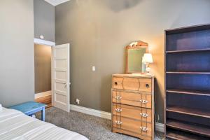 a bedroom with a dresser and a mirror at Bright Apartment, Near Vicksburg Military Park! in Vicksburg