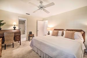 a bedroom with a bed and a desk and a piano at Pet-Friendly Home in Vero Beach, 1 Mi to Beach! in Vero Beach