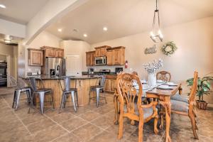 a kitchen and dining room with a table and chairs at Home with Yard and ATV Access to Sand Hollow State Park! in Hurricane