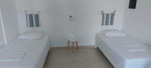 Postel nebo postele na pokoji v ubytování Telhinis Hotel & Apartments
