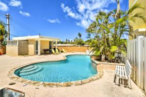 a swimming pool in the backyard of a house at Fajardo Townhouse with Private Pool and Ocean View in Fajardo