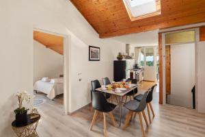 a kitchen and dining room with a table and chairs at Villa Paradiso: Near beach, superb pool and garden in Astrakeri