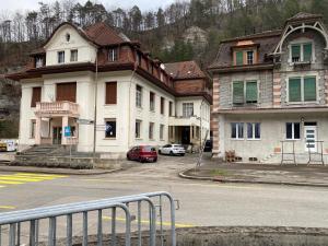 a group of buildings on the side of a street at Chambre Equipè à louer in Courrendlin