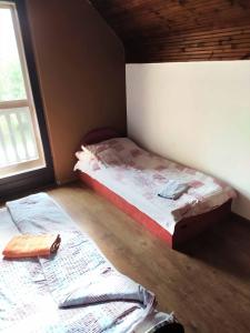 Posteľ alebo postele v izbe v ubytovaní Tassi Halászcsárda - Sügér ház