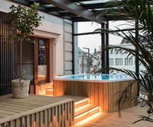 a hot tub on the balcony of a building at Aparthotel Cristina in Zakopane