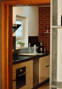 Kuchyň nebo kuchyňský kout v ubytování Modern holiday apartment in the heart of Klingenmünster + 6 fotografií