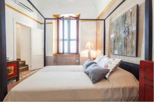 a bedroom with a large bed in a room at Atrani House-AMALFI in Atrani