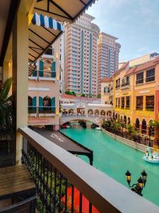 a view of a river in a city with buildings at Venice Luxury Residences in Manila