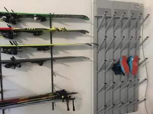 a rack with skis and ski equipment on it at Oberpalwitterhof in Barbiano