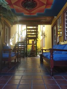 a room with beds and stairs in a building at Departamentos Temporarios Salta in Salta