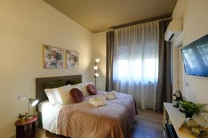 Postel nebo postele na pokoji v ubytování Verona Suites and Rooms
