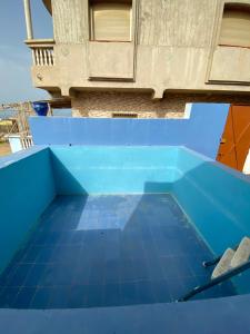 a view from the top of a blue swimming pool at Tardin in Nador