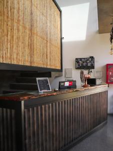 a bar with two laptops sitting on top of it at Hostal Litoral in Iquique