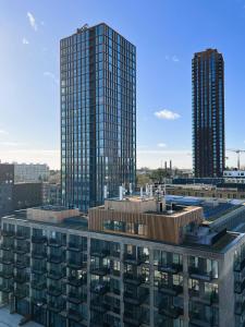 a view of two tall buildings in a city at ApartmentInCopenhagen Apartment 1527 in Copenhagen