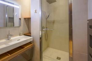 a bathroom with a shower and a sink at Spacious flat in the 8th district in Paris - Welkeys in Paris