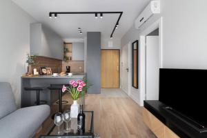 Televízia a/alebo spoločenská miestnosť v ubytovaní Easy Rent Apartments - WETTERA II