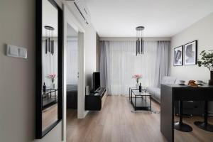 Televízia a/alebo spoločenská miestnosť v ubytovaní Easy Rent Apartments - WETTERA II