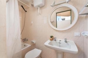 a bathroom with a sink and a mirror and a toilet at Mare de Deu del Carme 18 in S'Estanyol de Migjorn +12 photos