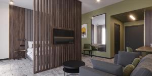 TV a/nebo společenská místnost v ubytování Restoria Hotel***