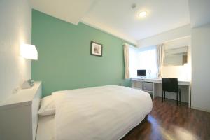 Giường trong phòng chung tại Hotel Granview Ishigaki