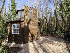 a tiny house in the middle of the woods at Honeycombe in Blandford Forum