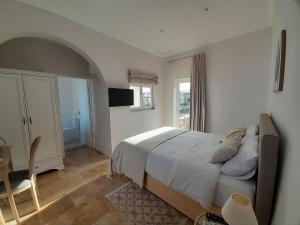 Postel nebo postele na pokoji v ubytování Palazzo Pisani Malta Boutique and SPA