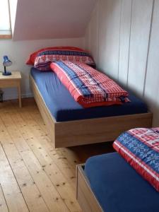 Säng eller sängar i ett rum på Ferienhaus, Stöckli Klingenbuch 20