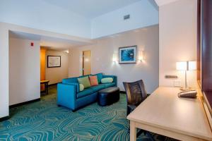 a living room with a couch and a table at Springhill Suites by Marriott Pueblo Downtown in Pueblo