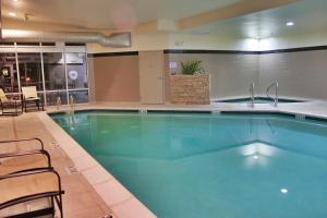 a large swimming pool in a hotel at Springhill Suites by Marriott Pueblo Downtown in Pueblo
