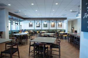 a dining room with tables and chairs in a restaurant at Fairfield Inn & Suites by Marriott Virgin Zion National Park in Virgin