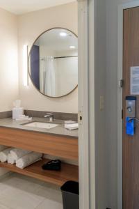 a bathroom with a sink and a mirror at Fairfield Inn & Suites by Marriott Philadelphia Valley Forge/Great Valley in Berwyn