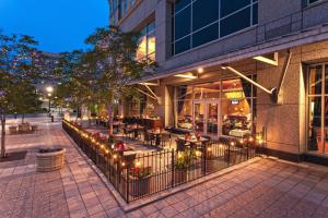 a restaurant with tables and chairs outside of a building at Marriott Salt Lake City Center in Salt Lake City