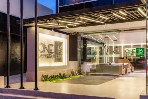 a store front of a building with a one piece store at One Sixteen Hotel in Bogotá