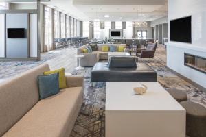 a hotel lobby with couches and a fireplace at Fairfield Inn & Suites by Marriott San Jose North/Silicon Valley in San Jose