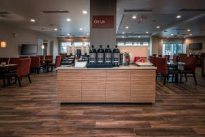 a restaurant with a counter with wine bottles on it at TownePlace Suites by Marriott Toledo Oregon in Oregon