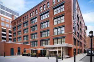 a large red brick building on a city street at Residence Inn by Marriott Boston Downtown Seaport in Boston