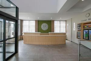 a lobby of a store with a counter in it at Fairfield Inn by Marriott JFK Airport in Queens