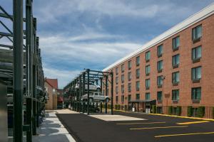 an empty street in front of a brick building at Fairfield Inn by Marriott JFK Airport in Queens