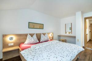 Ένα ή περισσότερα κρεβάτια σε δωμάτιο στο Kammerhof Apartment Birne