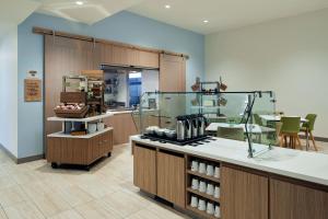 a kitchen with a counter in a room at Element Irvine in Irvine