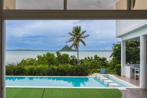 a view of the ocean from a house with a swimming pool at villa piscine à louer a DIEGO SUAREZ. MADAGASCAR in Diego Suarez +5 photos