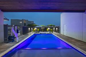 a swimming pool on the roof of a building at SpringHill Suites Waco in Waco