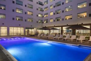 a large swimming pool in front of a building at Element Austin at The Domain in Austin