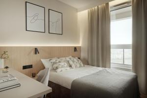 Posteľ alebo postele v izbe v ubytovaní SMART LOQUM-PanoramaVVita