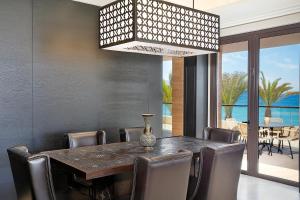 a dining room with a table and chairs at Al Manara, a Luxury Collection Hotel, Aqaba in Aqaba