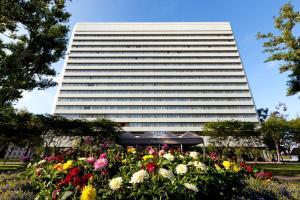 a tall building with flowers in front of it at The Westin South Coast Plaza, Costa Mesa in Costa Mesa