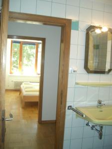 a bathroom with a sink and a mirror at Gartenapartment in Zell am See