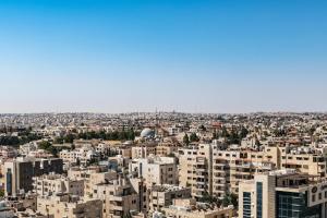 an aerial view of a city with tall buildings at Sheraton Amman Al Nabil Hotel in Amman